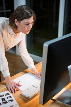 Businesswoman working on computer at her desk in the office